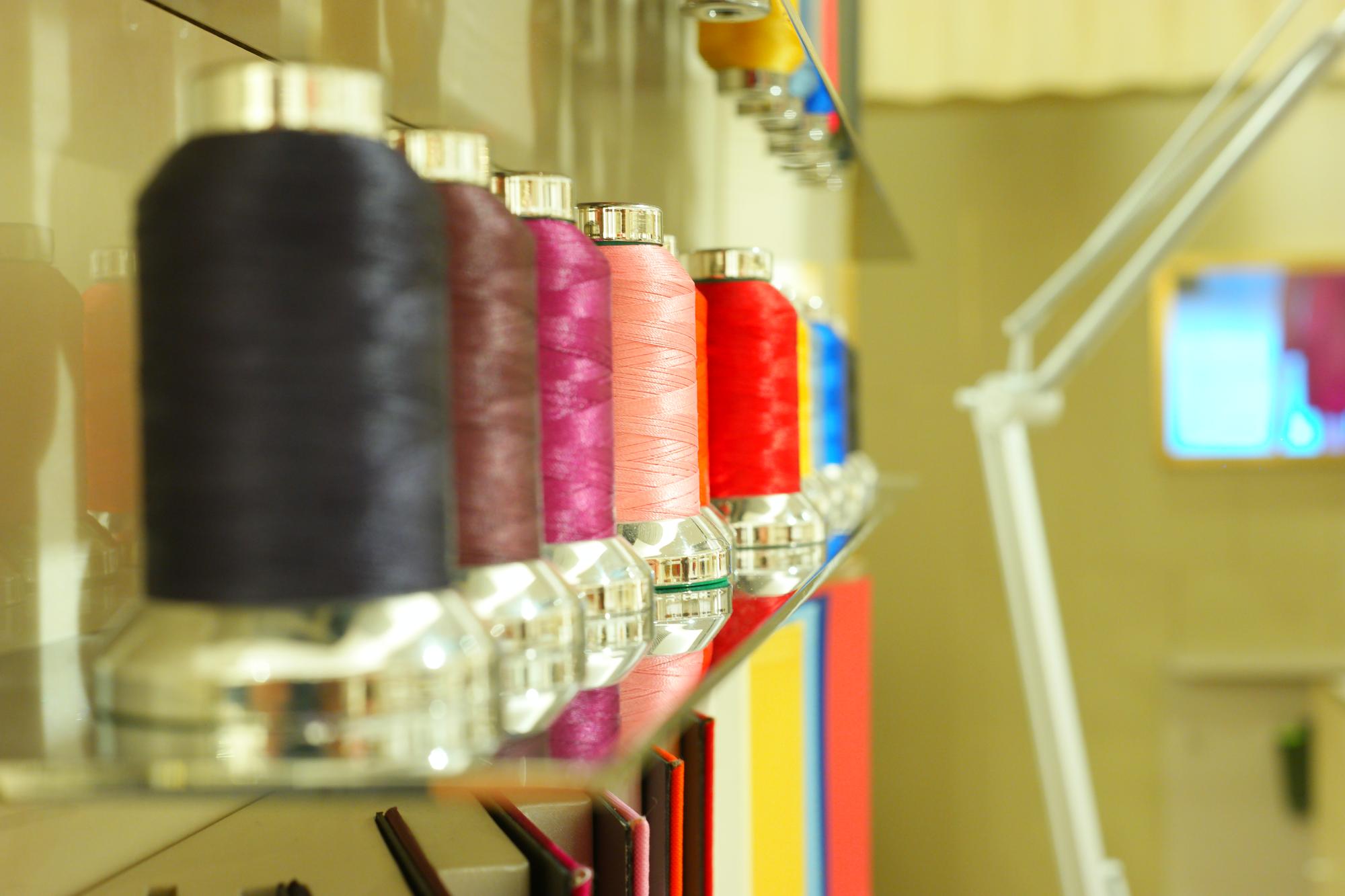 Workshop studio with embroidery machine and threads