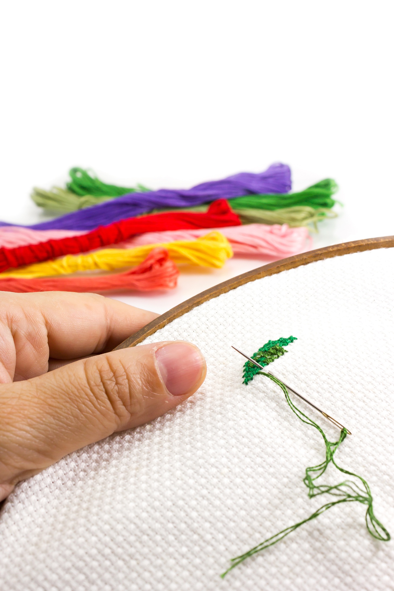 Close-up of colorful hand embroidery on fabric
